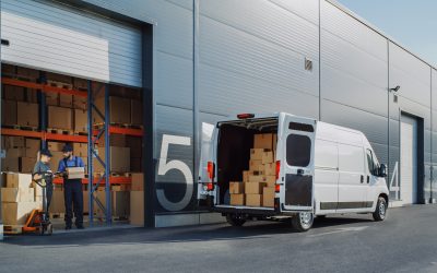 Outside,Of,Logistics,Warehouse,With,Open,Door,,Delivery,Van,Loaded